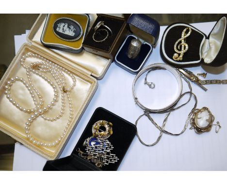 A Victorian cameo brooch, female head; a silver bangle; a double row of simulated pearls; a selection of costume jewellery