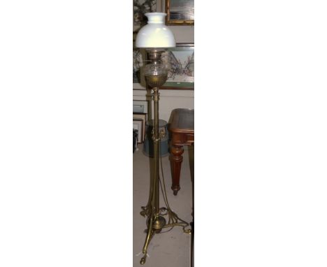 An Art Nouveau floor brass floor standing oil lamp with cut glass reservoir (drilled), 62"