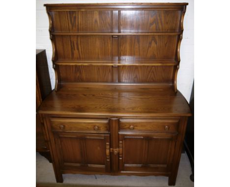 An Ercol dresser with plate rack above