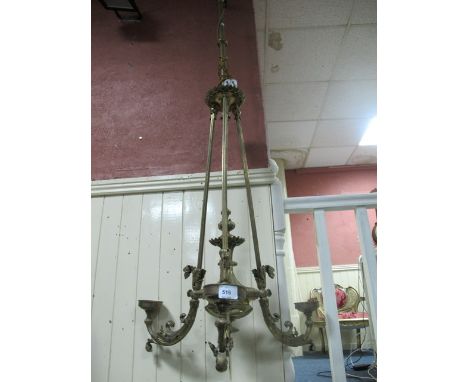 A VICTORIAN BRASS THREE BRANCH CENTRE LIGHT the knoped column issuing three reeded arms with foliate cast branches 265cm drop