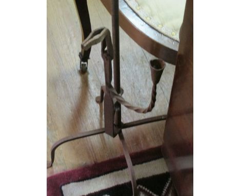 A WROUGHT IRON RUSH LIGHT 110cm high
