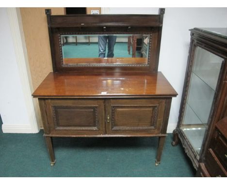 AN EDWARDIAN MAHOGANY SIDE CABINET the super structure with bevelled glass mirror and moulded shelf the base with cupboards o