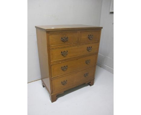 A GEORGIAN STYLE MAHOGANY CHEST the rectangular top with two short and three long drawers with brass drop handles on bracket 