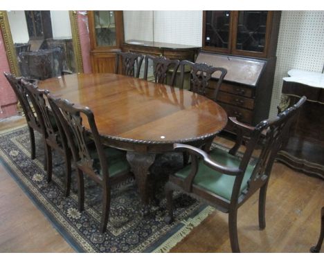 A NINE PIECE CHIPPENDALE STYLE MAHOGANY DINING ROOM SUITE comprising eight chairs including a pair of elbow chairs each with 