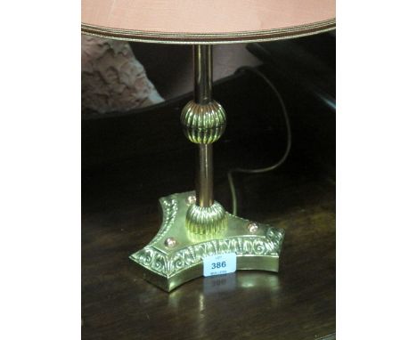 A VICTORIAN BRASS AND COPPER TABLE LAMP the cylinderical knoped column on concave base with shade 55cm high