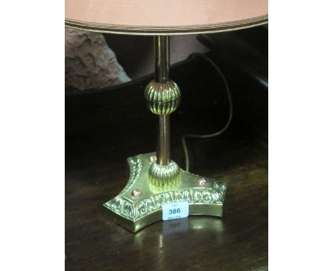 A VICTORIAN BRASS AND COPPER TABLE LAMP the cylinderical knoped column on concave base with shade 55cm high