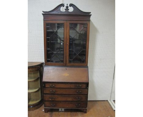 AN EDWARDIAN MAHOGANY AND SATINWOOD CROSS BANDED BUREAU BOOKCASE the architectural pediment above a pair of astragal glazed d