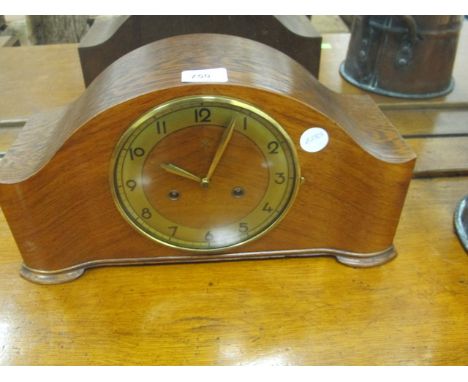 A WALNUT CASED MANTLE CLOCK with Westminister chime
