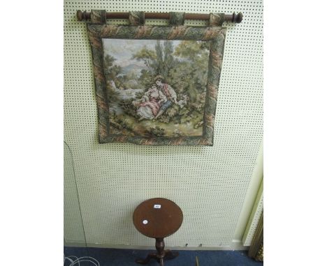 A MAHOGANY WINE TABLE of circular form on tripod support 57cm (h) x 29cm (d) together with a needlework wall hanging 