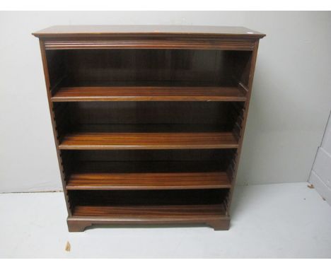A MAHOGANY OPEN FRONT BOOKCASE the rectangular top above three adjustable shelves raised on bracket feet 107cm (h) x 92cm (w)