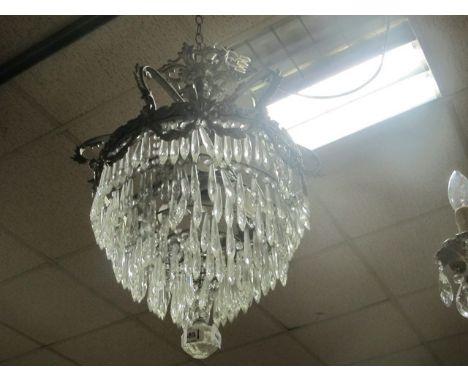 A CONTINENTAL CHROME AND CUT GLASS FOUR LIGHT CHANDELIER hung with cascading pendants 77cm drop
