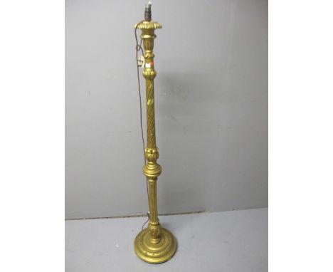 A CONTINENTAL FLOOR STANDARD LAMP the spiral twist and fluted column raised on a circular foot 147cm high