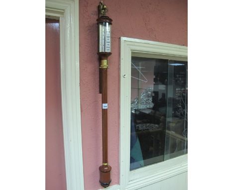 A GOOD WALNUT AND BRASS MOUNTED BAROMETER AND THERMOMETER of cylindrical form 93cm (h)