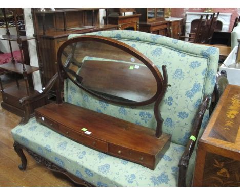 A MAHOGANY CRUTCH MIRROR 19th Century the oval plate within a moulded frame with satinwood string inlay raised on shaped supp