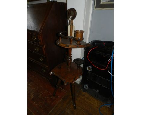 A mahogany pipe stand, raised on a tripod base.  H.103cm