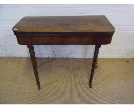 A Georgian mahogany D shape fold over card table with ring turned legs - Width 91 cm - Top closed 44 cm - Open 89 cm - Height