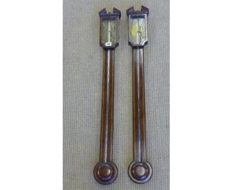 A pair of mahogany stick barometer with brass dials engraved Manticha & Fecit - reading Very Dry to Stormy - Height 95 cm 