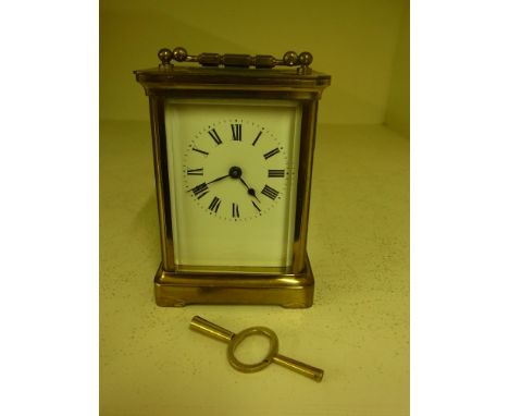 A French brass carriage clock time piece with key - Height 12 cm
Condition report:  Working