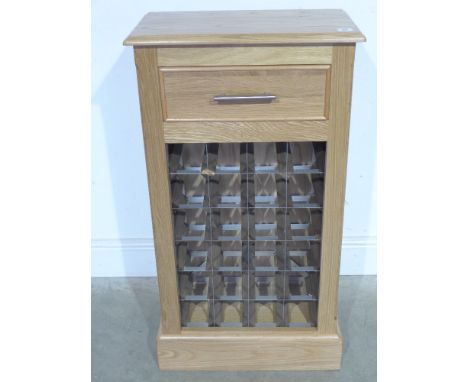 A light oak wine rack - holding twenty four bottles