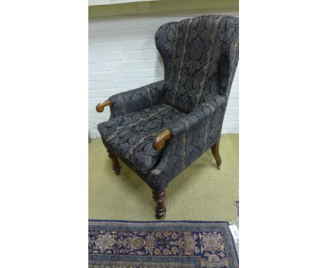 A very good late Regency IV mahogany library chair with upholstered high back with shallow wings enclosed arms terminating in