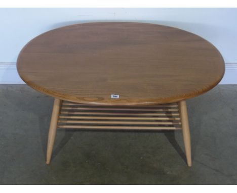 An Ercol coffee table with under tier - 82 cm x 1 m