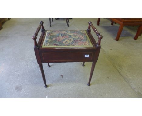 An Edwardian mahogany and line inlaid piano stool with floral tapestry seat 
