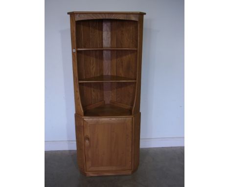 A light elm Ercol corner cupboard with a base door - Height 1.8 m x Width 75 cm 