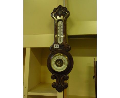 An early 20th century oak case barometer - the dial with scale 27 to 31 with thermometer above 
Condition report: Working