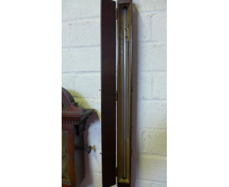 A Georgian mahogany balloonists stick barometer with a door enclosing the dial  - signed Cox, London 
Condition report:  Merc