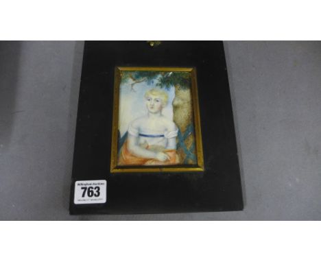 A 19th century portrait miniature on ivory of a young girl and her cat - 11 cm x 8 cm - in an ebonised frame 
Condition repor