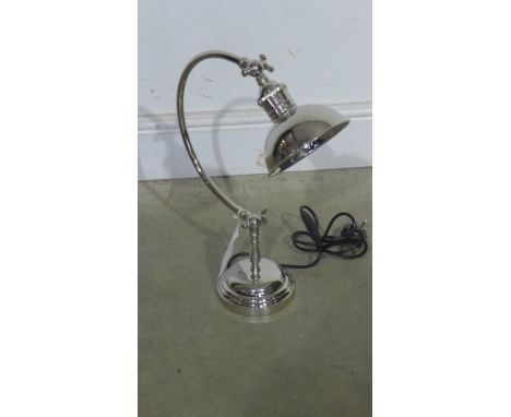 A plated desk lamp on circular base 
Condition report: Wired and Pat tested
 