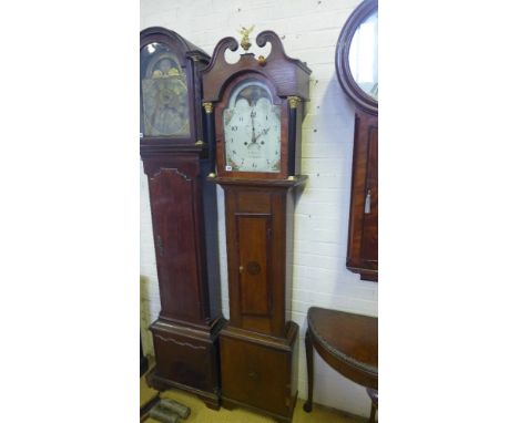 A mahogany and oak cased longcase clock with a painted 12" moonroller dial having secondary and calendar dials signed T Morga