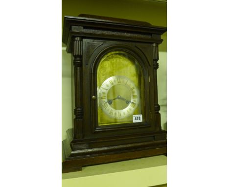A Junghams three train eight day Westminster bracket clock - brass arch shaped dial having wind hole and cover top left mirro