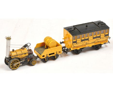 Tri-ang OO Stephensons 'Rocket' with 'Experience' Coach - Side piston cylinder is detached from body. Conditions: Poor Plus t