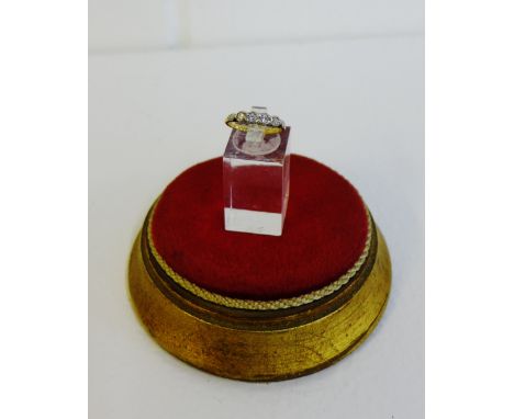 An 18 carat gold four stone diamond ring, UK ring size K