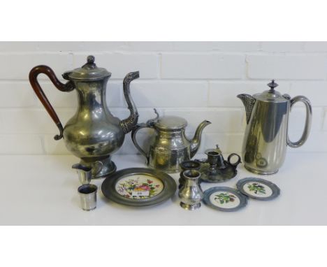 A collection of pewter to include a coffee pot, candle chamber stick, measures, jugs, pewter rimmed ceramic plates and coaste