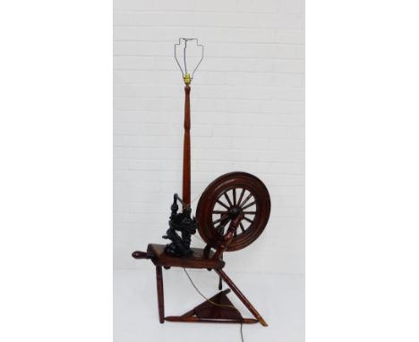 A late 19th century spinning wheel adapted to form a standard lamp, 150 x 84cm 