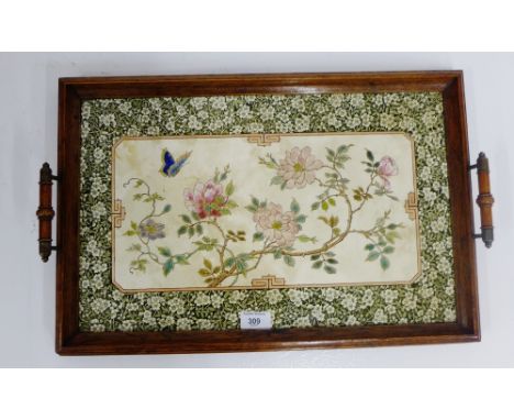 An Edwardian oak tray with inset Japanesque ceramic panel, 55 x 36cm 