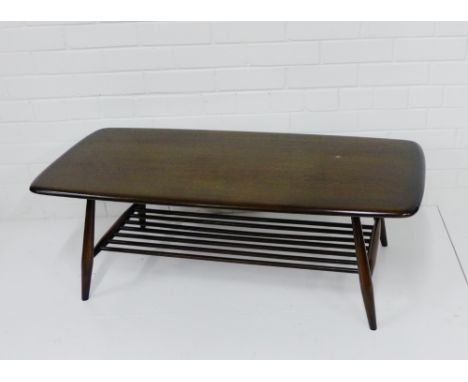 An Ercol dark elm coffee table, 37 x 104cm