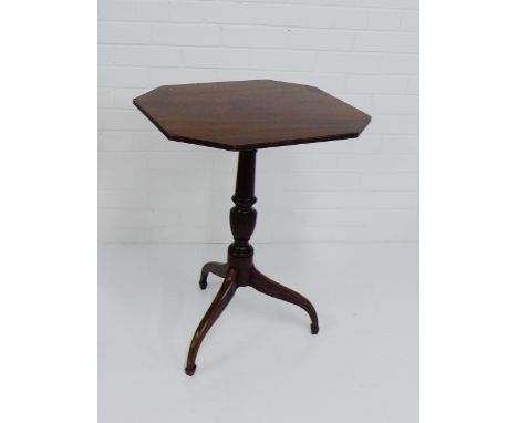 A mahogany side table, the octagonal top on tripod supports 70 x 56cm 