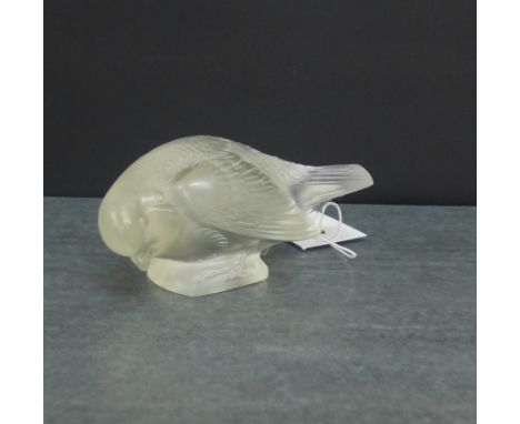 A Lalique opaque glass bird, with etched R. Lalique mark to base (slight damages), 12.5cm long