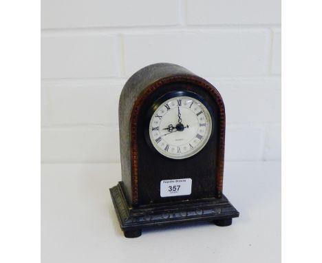 An oak cased mantle clock