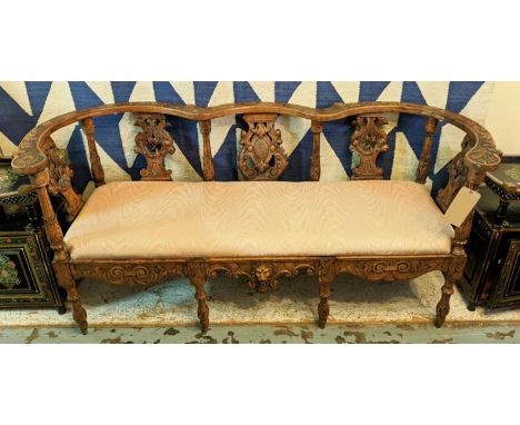 SOFA, 162cm W x 73.5cm H late 19th century Continental walnut with a curved back rail and carved decoration. 