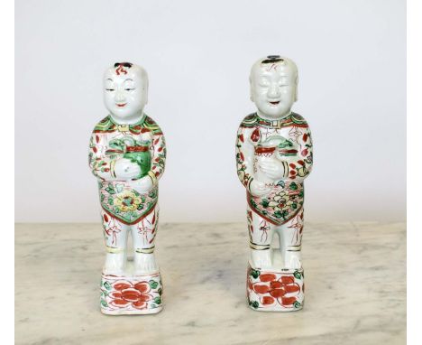 CHINESE 'LAUGHING BOYS', a pair famille-verte matched on possibly Kangxi, 28cm H. (2) 