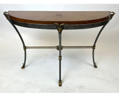 MAITLAND-SMITH CONSOLE TABLE, steel and gilt metal with goat head mounts and tooled leather top raised on hoof supports, 74cm