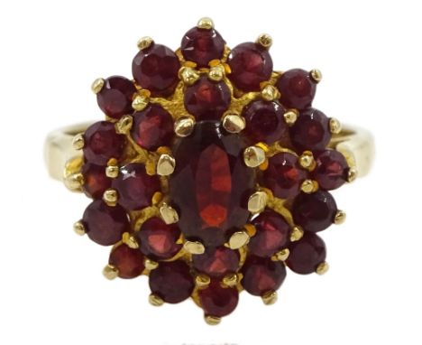 Gold oval and round garnet cluster ring, stamped 9ctCondition Report:Approx 4gm, size M, stones appear secure in setting, wel