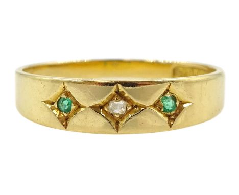 Early 20th century gold three stone gypsy set emerald and diamond ring, stamped 18ct Condition Report:Approx 2.52gm, size Q, 