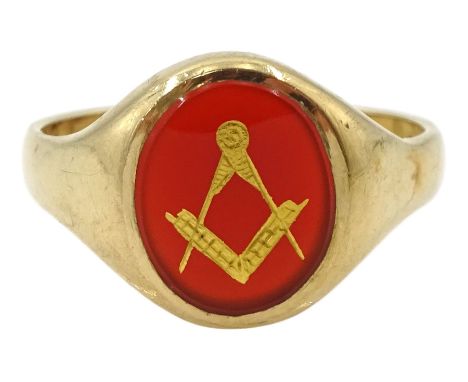 9ct gold Masonic ring, the oval carnelian with applied gold square and compass decoration, London 1961Condition Report:Approx