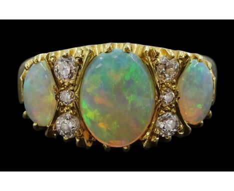 18ct gold three stone opal and six stone old cut diamond ring, hallmarkedCondition Report:Approx 5.05gm, size Q, max depth = 