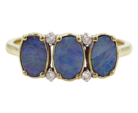 9ct gold three stone opal doublet ring, with four diamond accents set betweenCondition Report:Approx 1.8gm, tested 9ct, size 